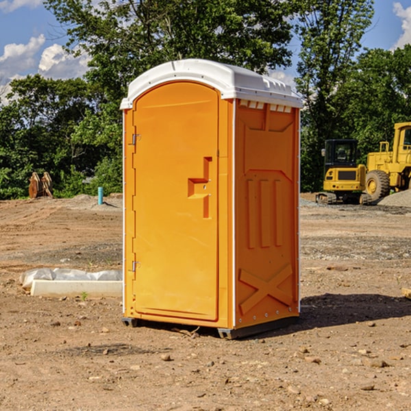 what is the cost difference between standard and deluxe portable restroom rentals in Dewey County